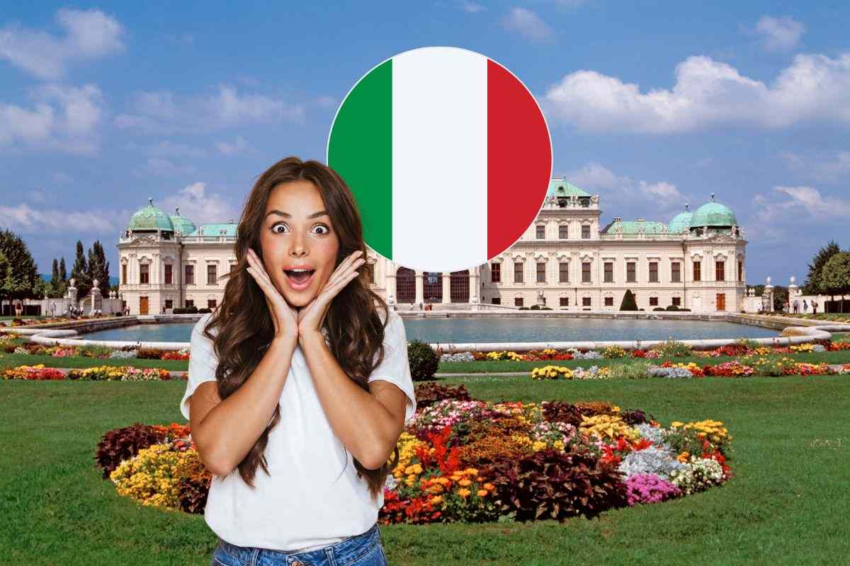 sfondo del palazzo reale di vienna, donna stupita in primo piano e bandiera con i colori dell'italia