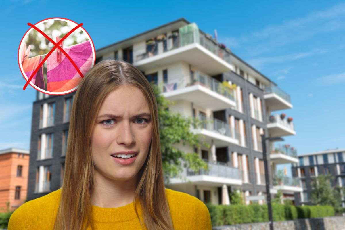 condominio sullo sfondo, panni stesi su corde con x rossa e donna sorpresa